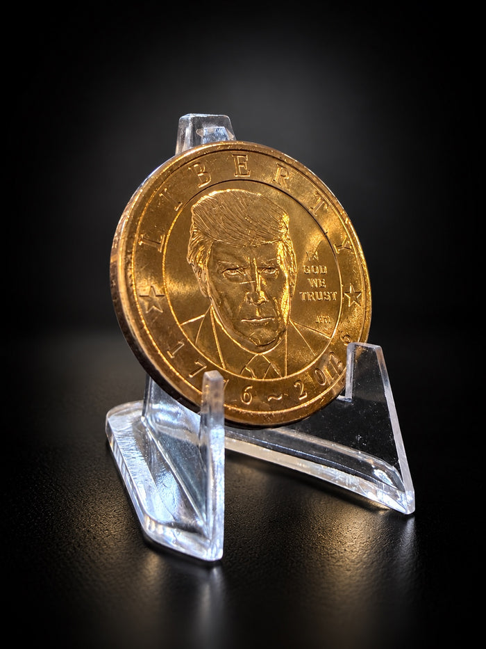 Donald Trump dollar portrait on a clear stand against a black background