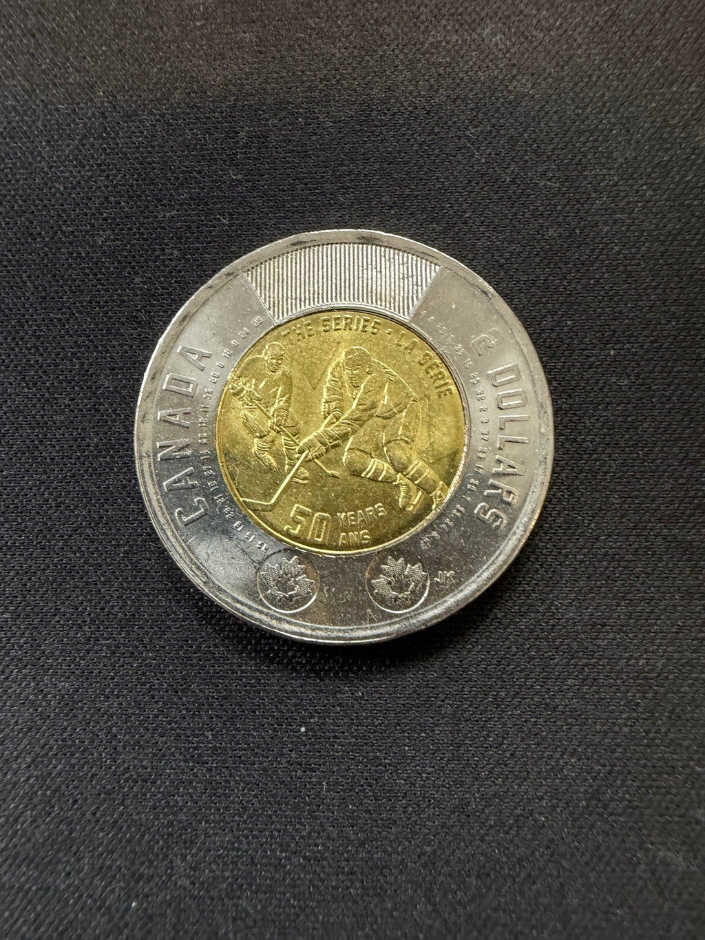 Representative 2022 Summit Series uncolourized circulated toonie, reverse