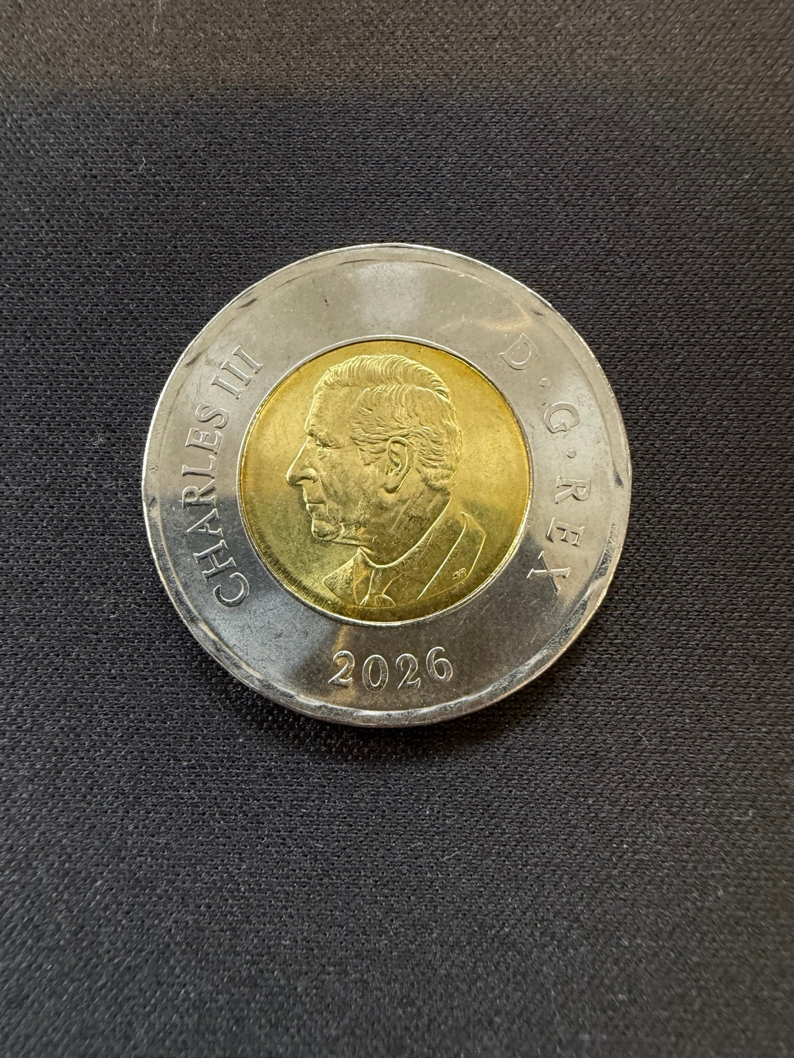 2026 CN Tower uncolourized toonie obverse, representative circulated coin