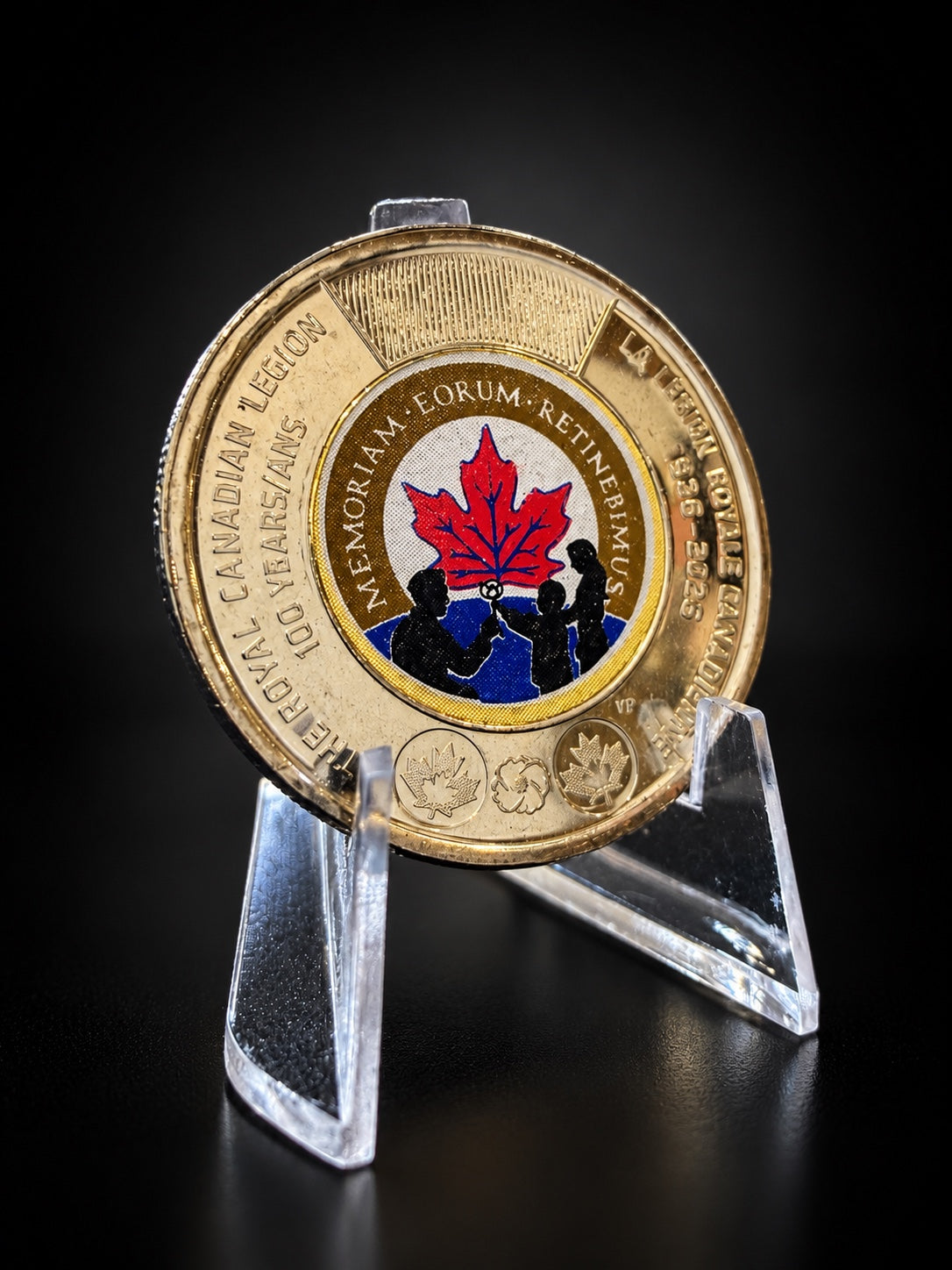 2026 Royal Canadian Legion 100th anniversary toonie, colourized on stand