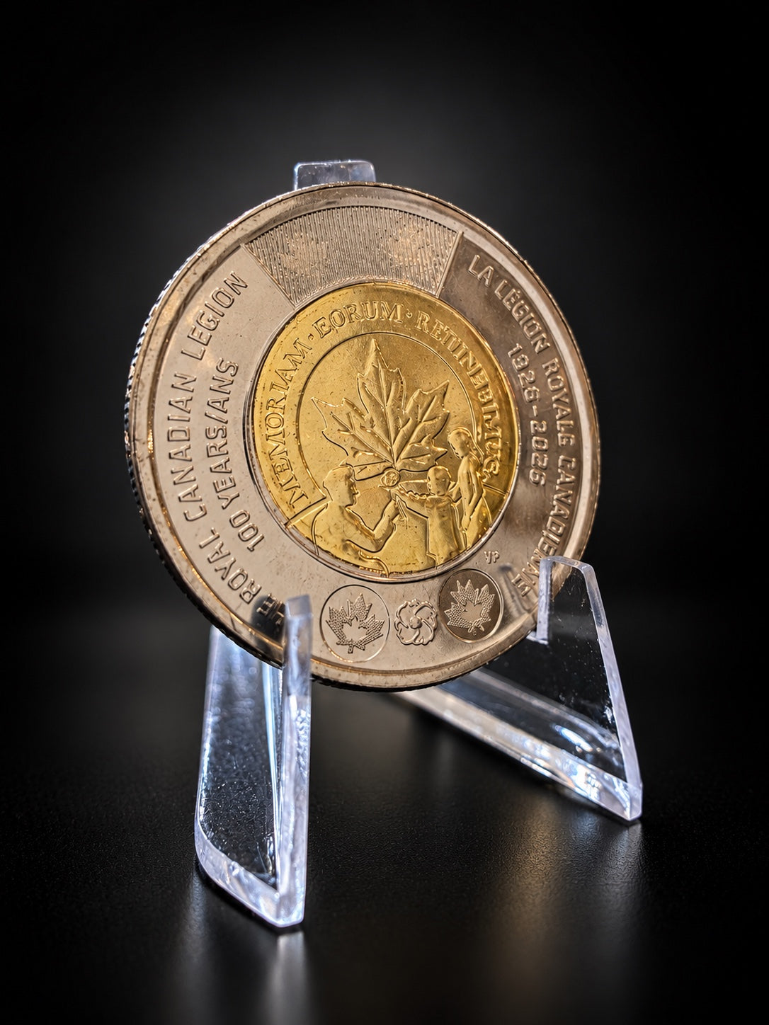 2026 Royal Canadian Legion 100th anniversary toonie, uncolourized on stand