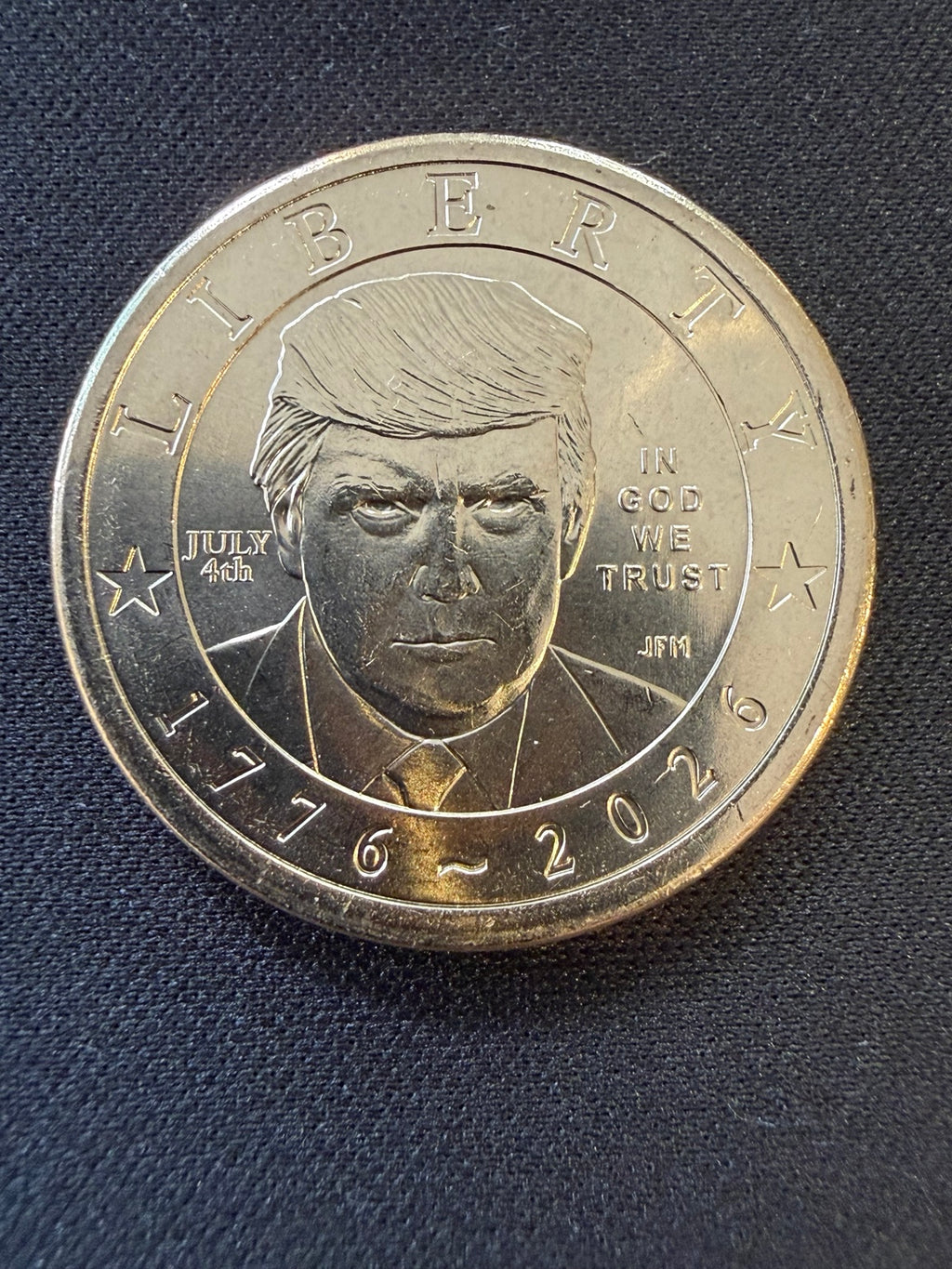 Close-up of Donald Trump portrait and July 4th privy