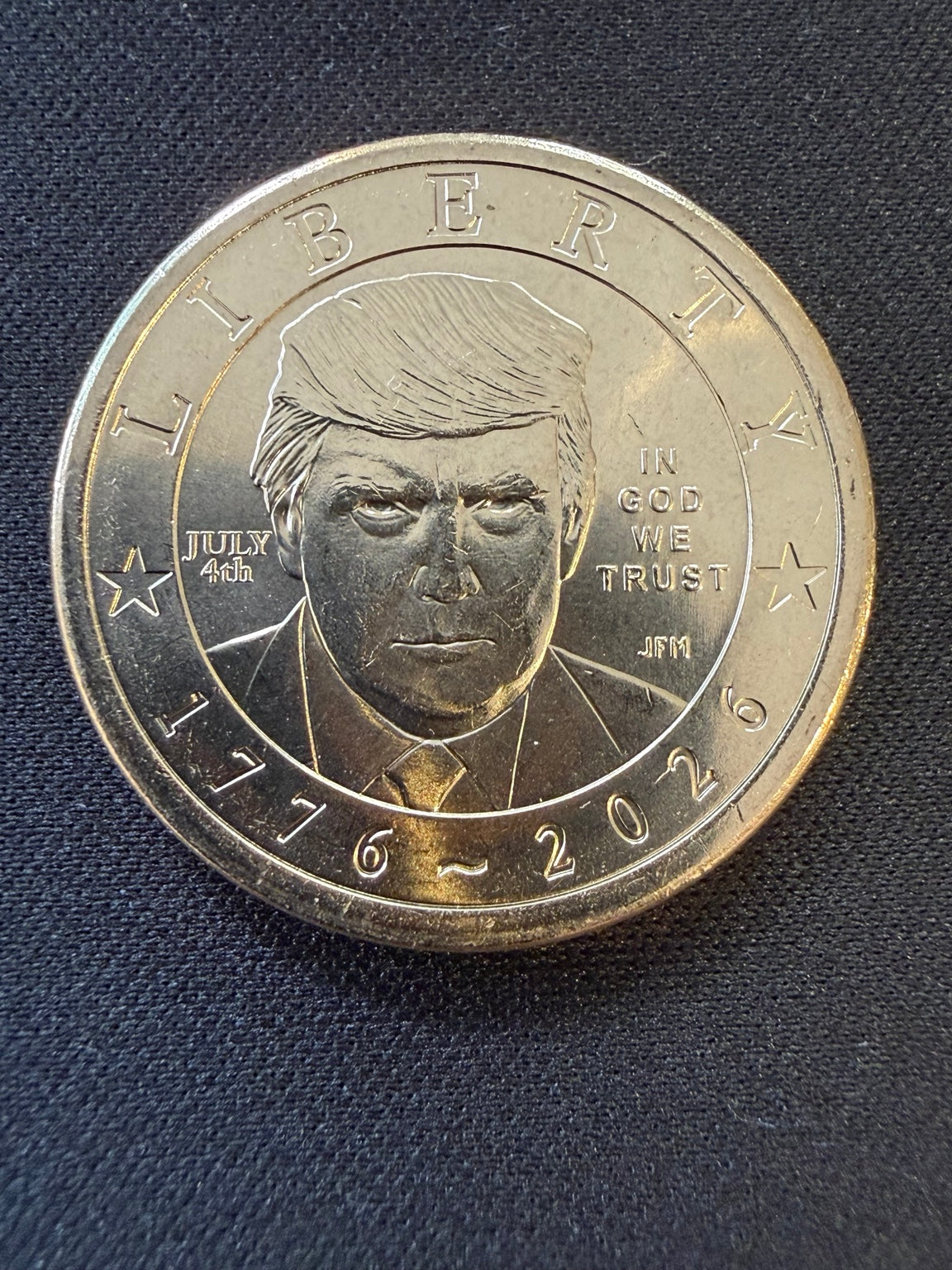 Close-up of Donald Trump portrait and July 4th privy
