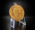 Donald Trump dollar with July 4th privy on a clear display stand