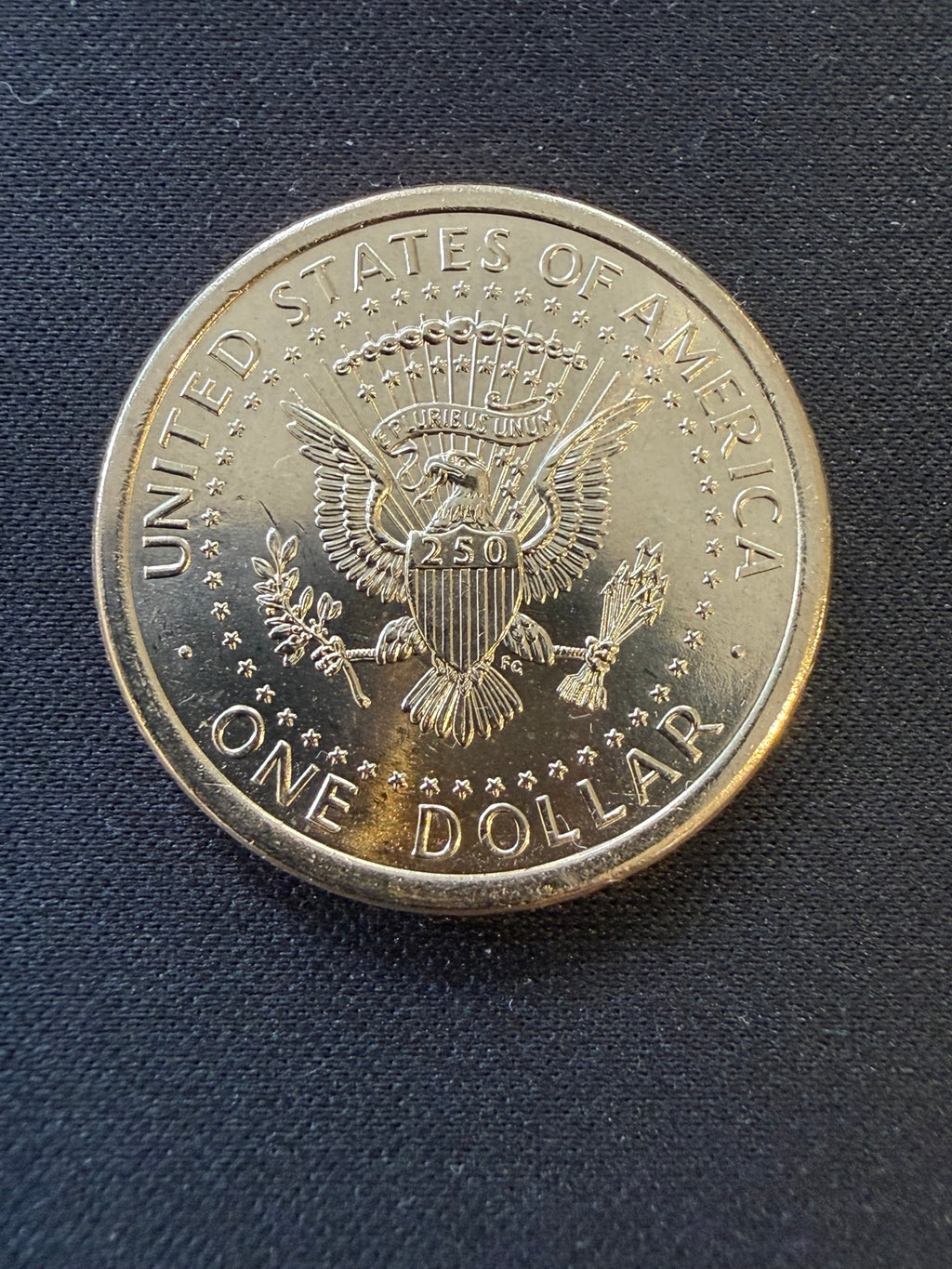 Close-up of semiquincentennial dollar eagle reverse